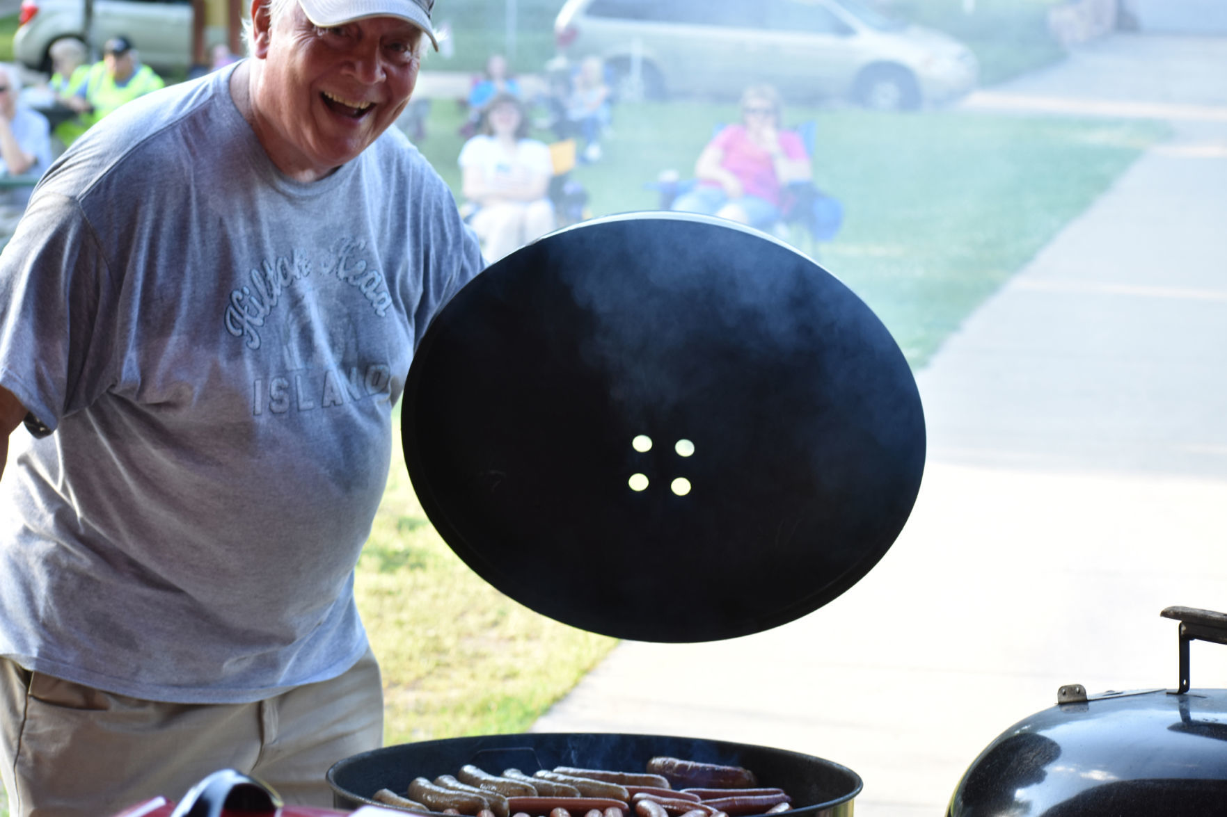 George Beasley shows off bratwursts